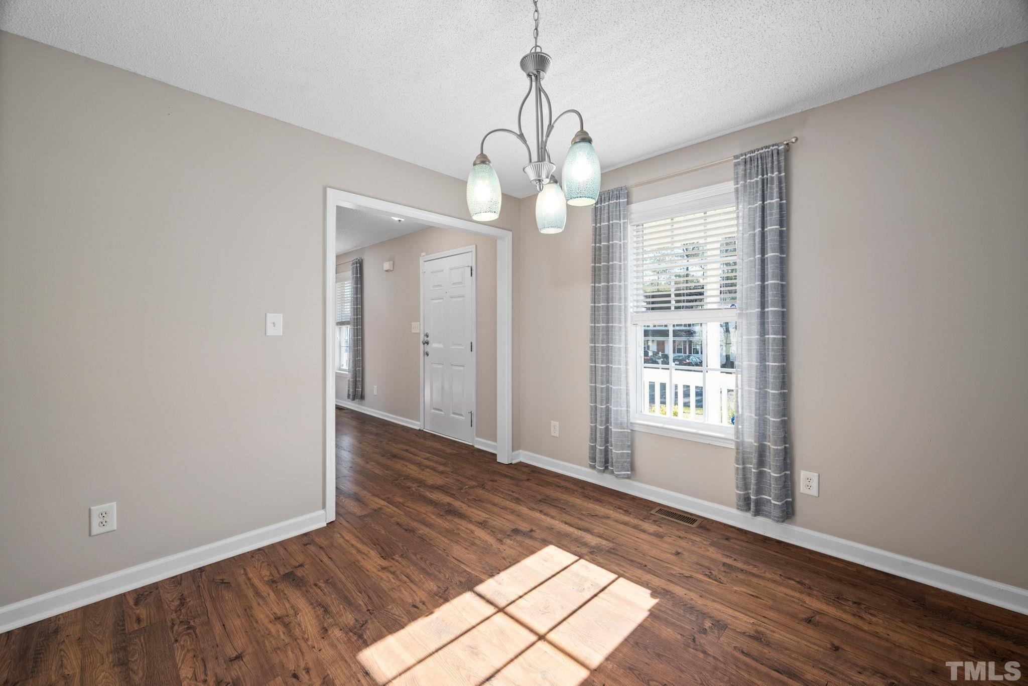 124 Gentle Rio Court Garner, NC 27529 - Photo 20 of 37 a view of a room with wooden floor and windows