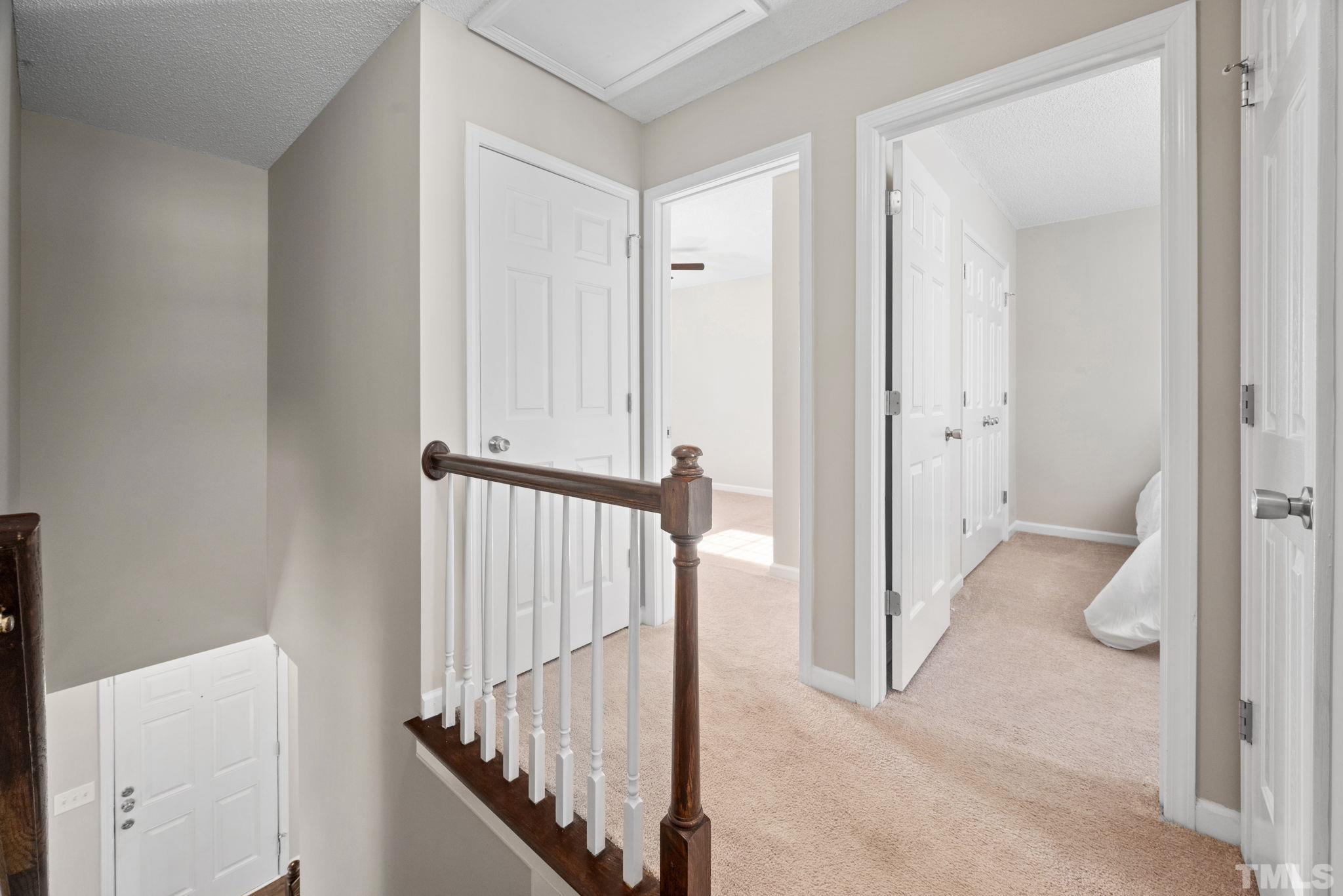 124 Gentle Rio Court Garner, NC 27529 - Photo 22 of 37 a view of a hallway with wooden floor and entryway
