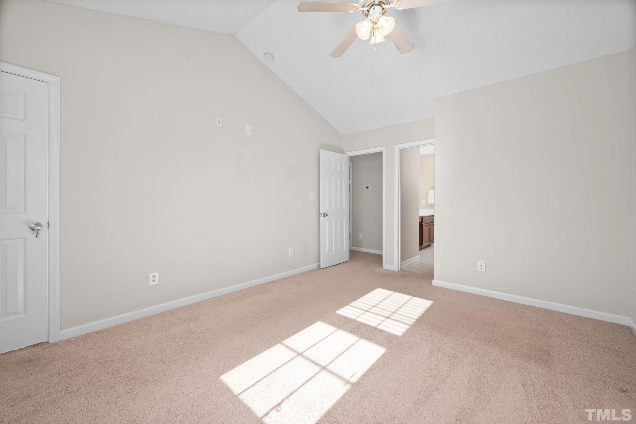 124 Gentle Rio Court Garner, NC 27529 - Photo 23 of 37 a view of a big room with windows and chandelier fan