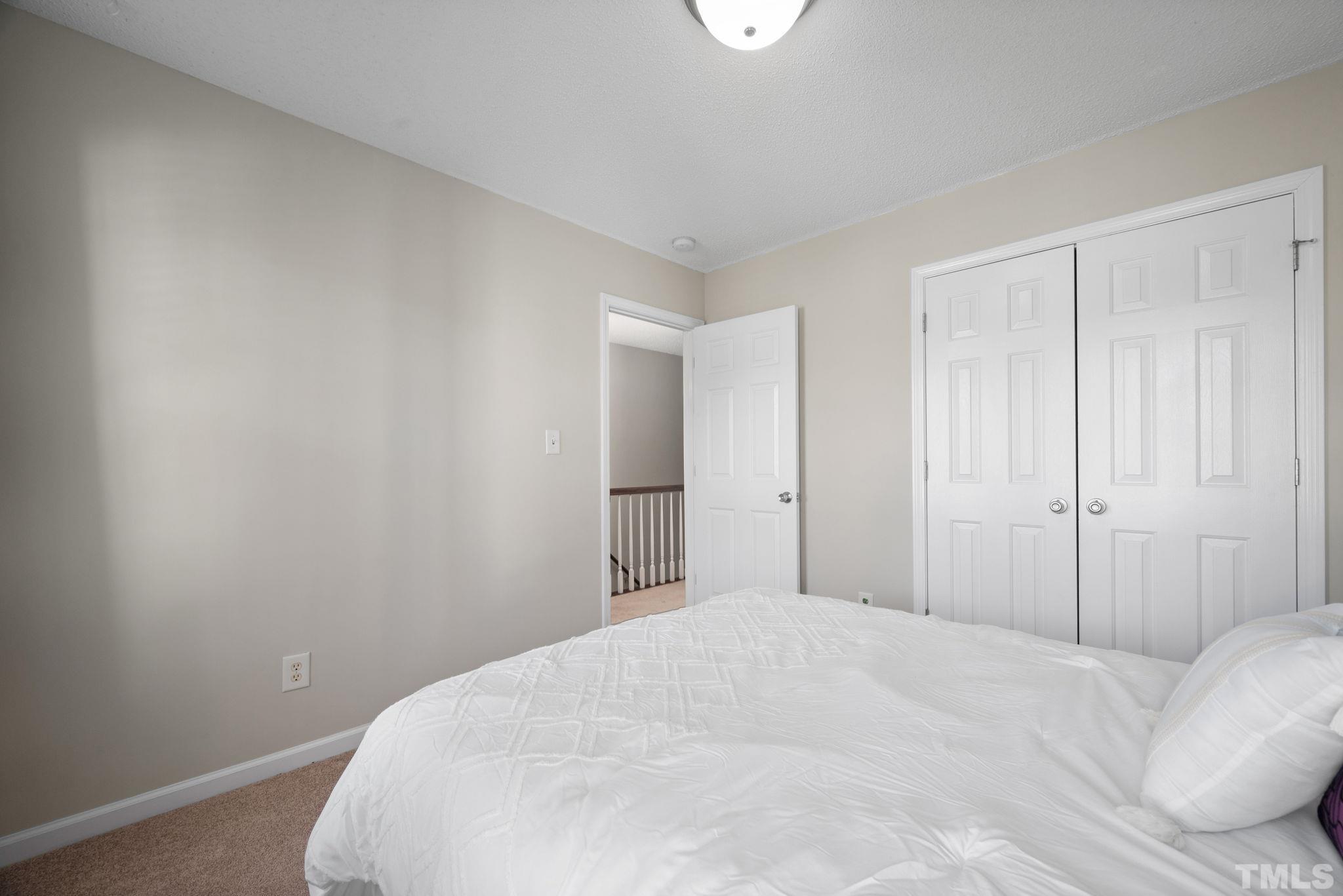 124 Gentle Rio Court Garner, NC 27529 - Photo 28 of 37 a bedroom with a bed and a window