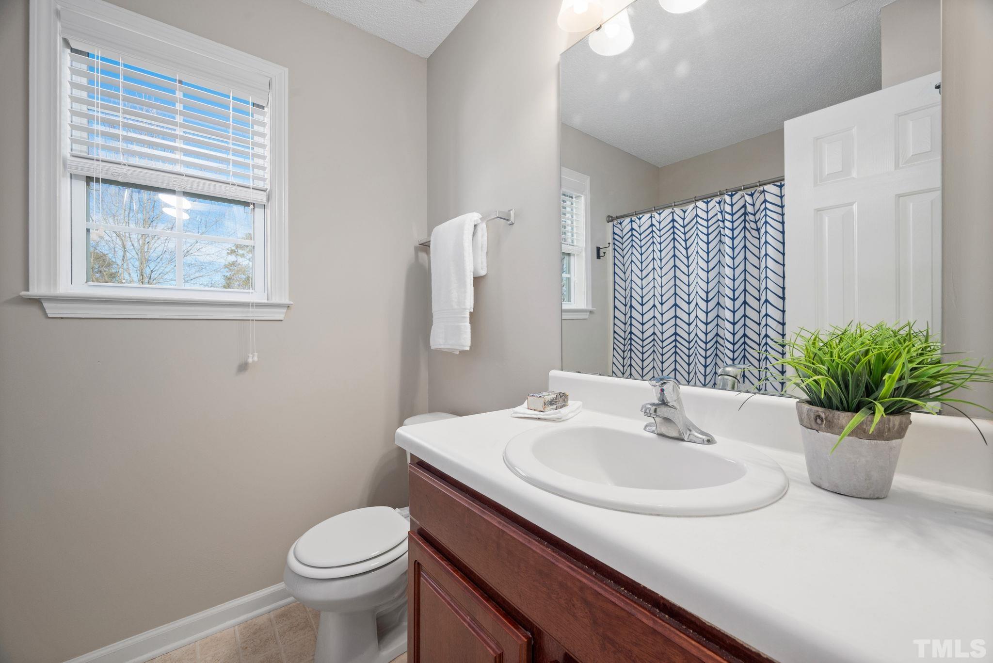 124 Gentle Rio Court Garner, NC 27529 - Photo 29 of 37 a bathroom with a sink and a toilet