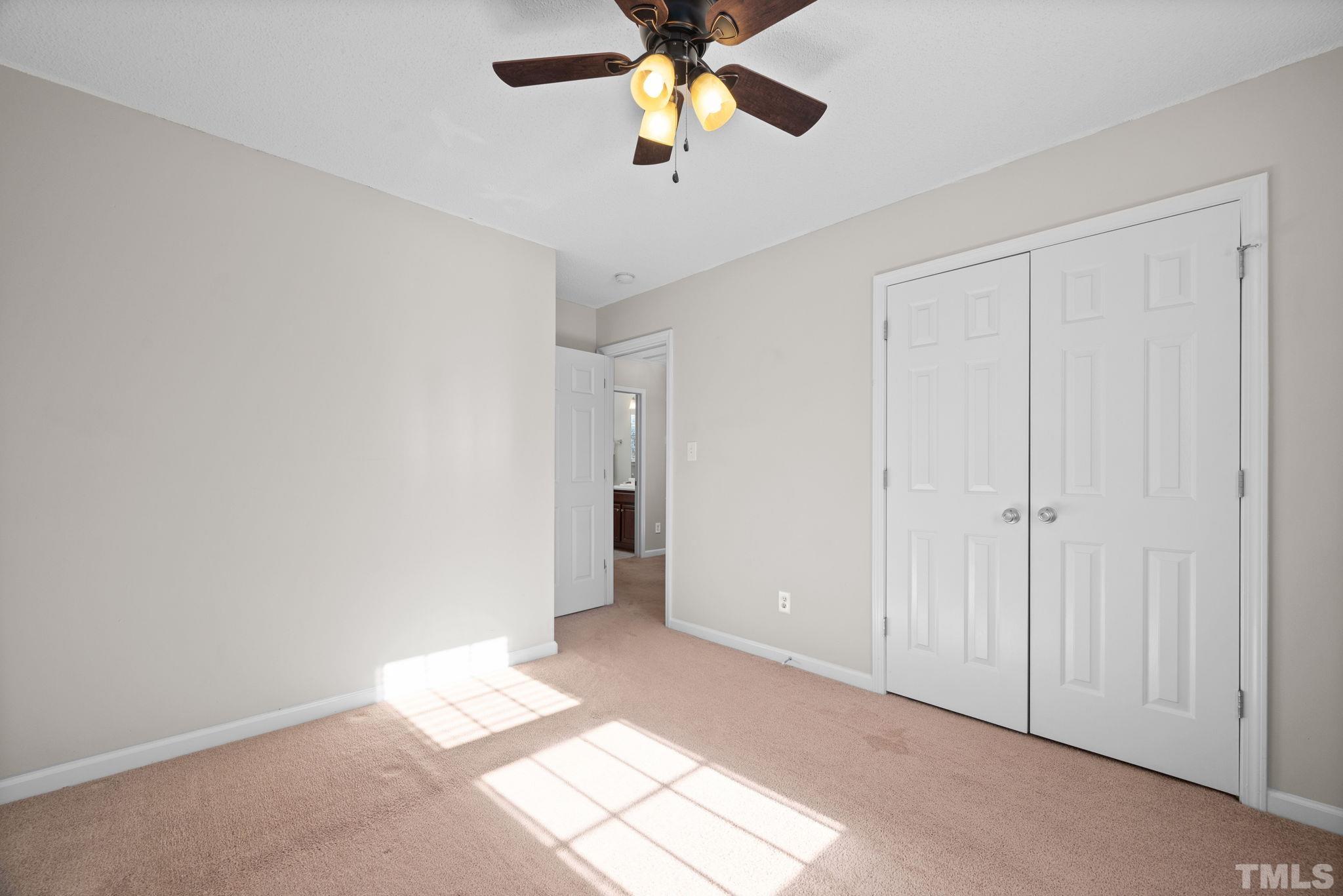 124 Gentle Rio Court Garner, NC 27529 - Photo 30 of 37 a view of an empty room and chandelier fan