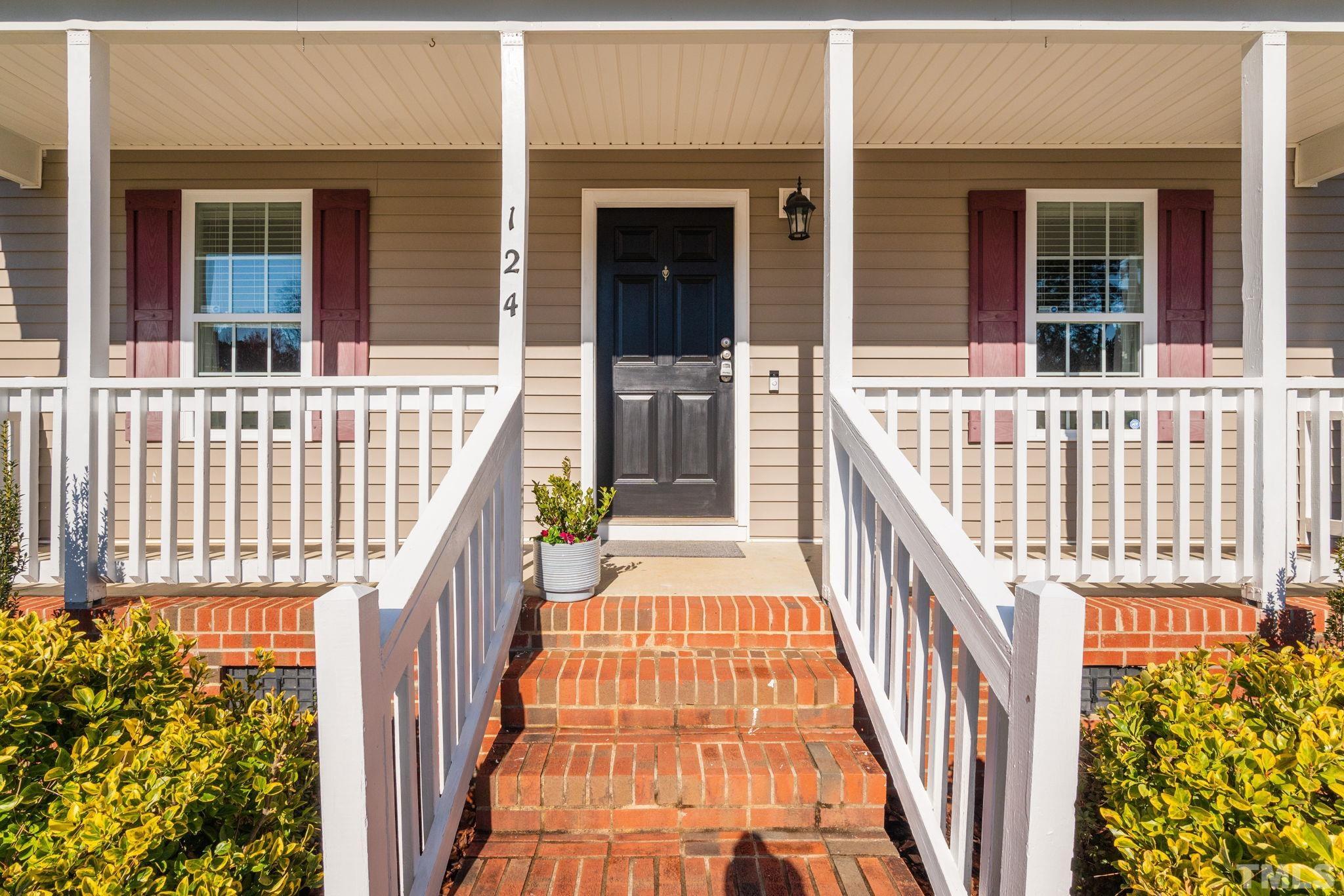 124 Gentle Rio Court Garner, NC 27529 - Photo 8 of 37 front view of a house with a porch