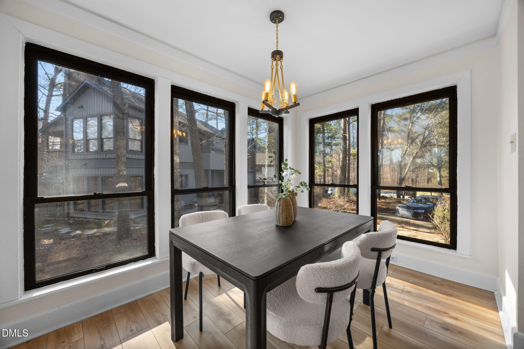 10 Melstone Turn Durham, NC 27707 - Photo 6 of 21 a view of a dining room with furniture large windows and wooden floor