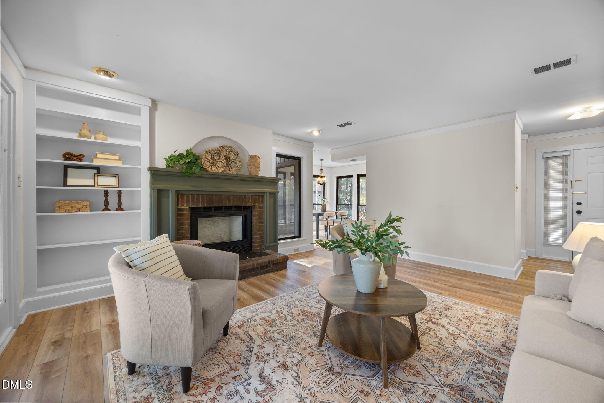 10 Melstone Turn Durham, NC 27707 - Photo 8 of 21 a living room with furniture a fireplace and a potted plant