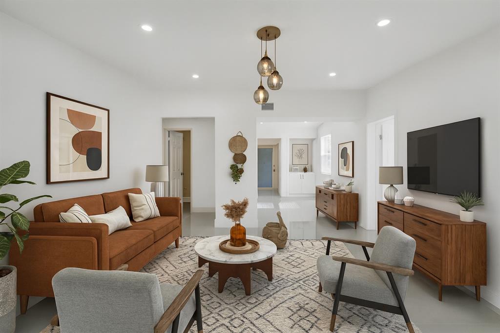 a living room with furniture and a flat screen tv