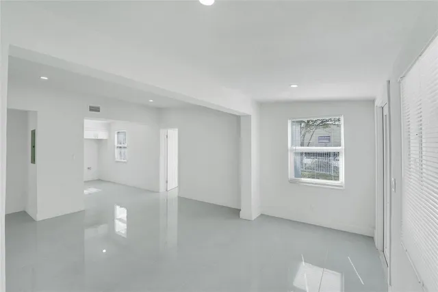 a view of an empty room with a window