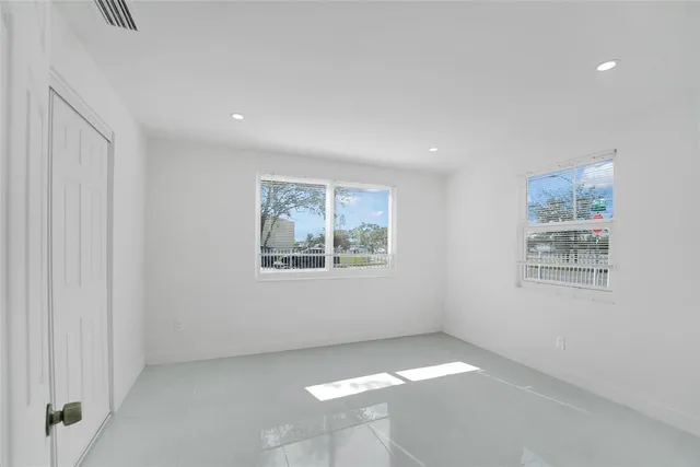 an empty room with windows