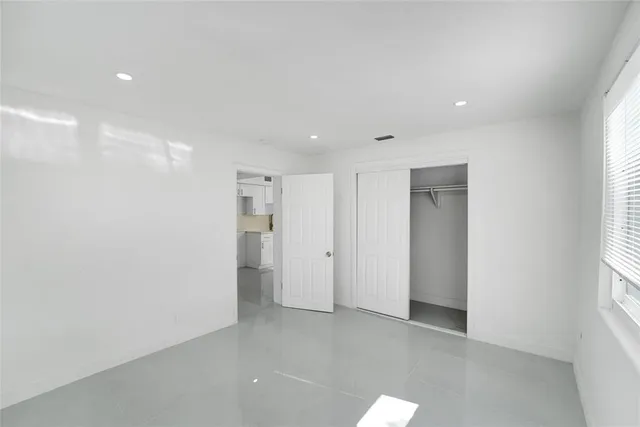 a bathroom with a toilet sink and shower