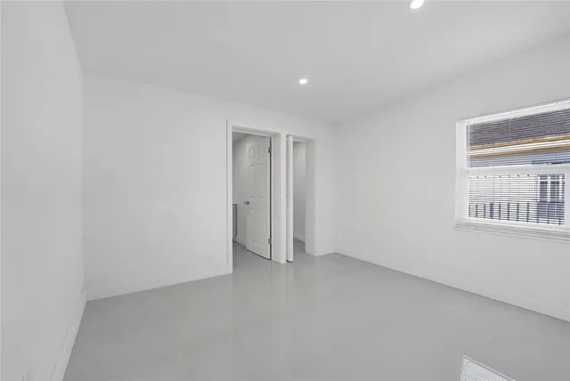 a view of room with windows and bathroom view