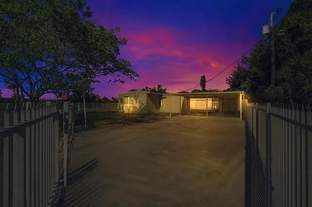 a view of a back yard of the house with a small yard