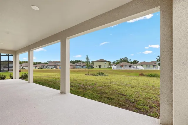 an aerial view of a house with a ocean view