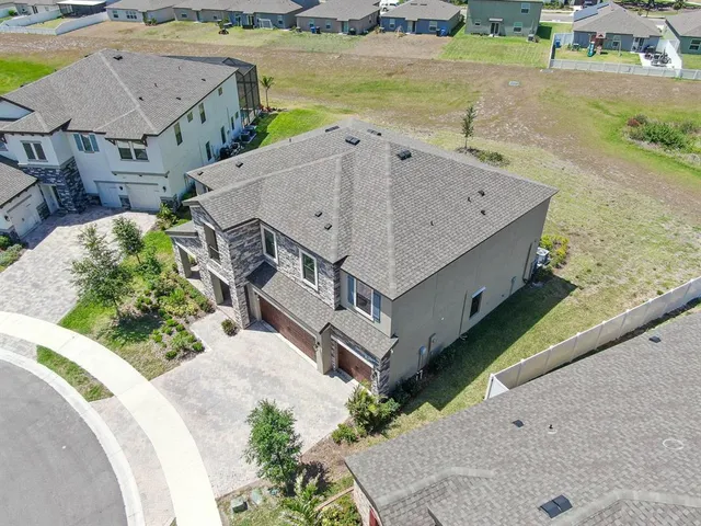 an aerial view of a house with swimming pool