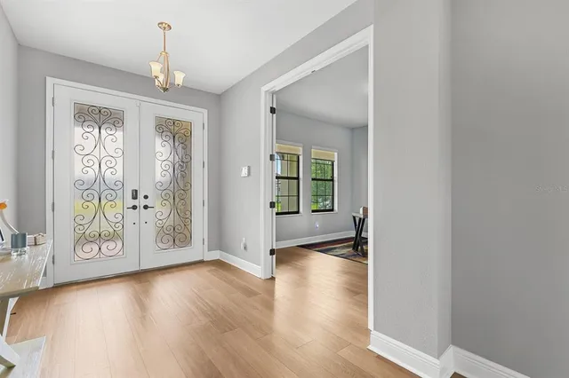 a view of an entryway with wooden floor