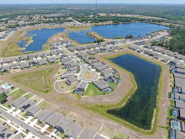 a front view of building with a yard