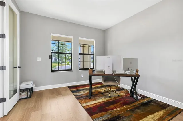 a workspace with furniture and a window