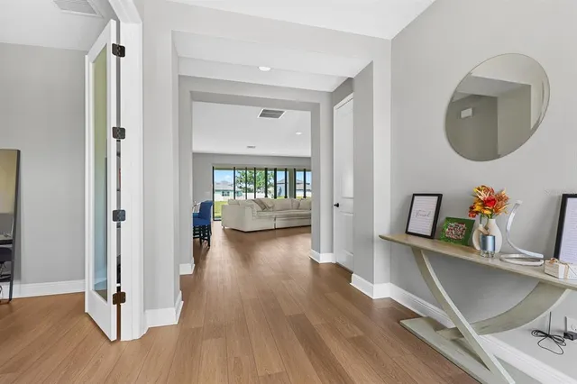 a view of a living room and a wooden floor