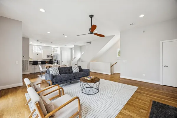 a living room with furniture and a rug