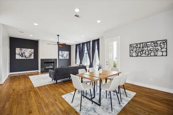 a view of a dining room with furniture and window