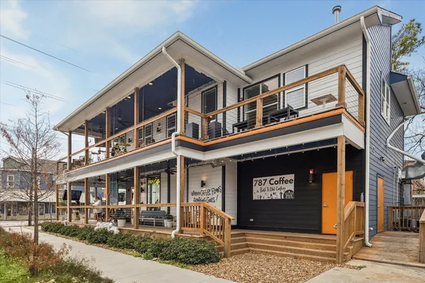 a view of a cafe with sitting area