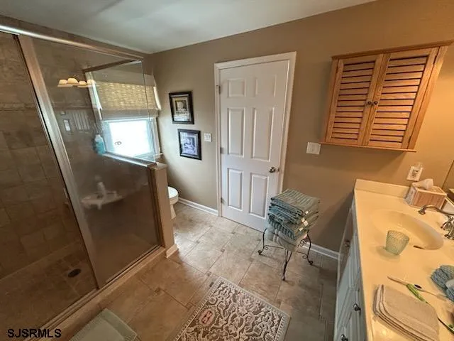 a view of hallway with furniture and a window