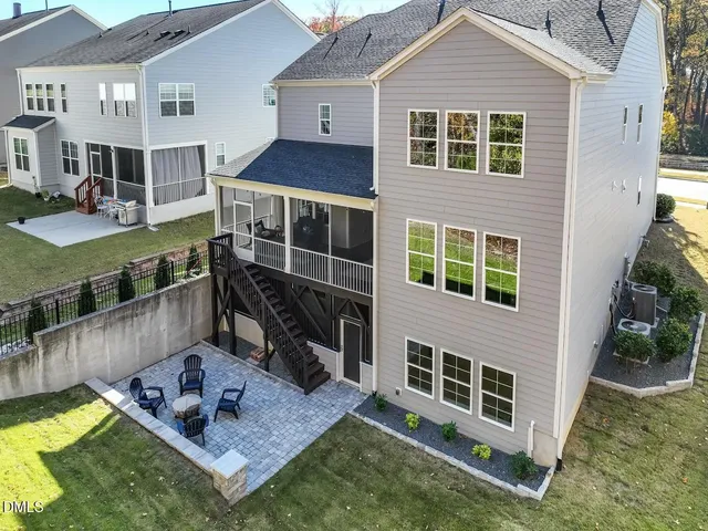a view of a house with backyard and balcony