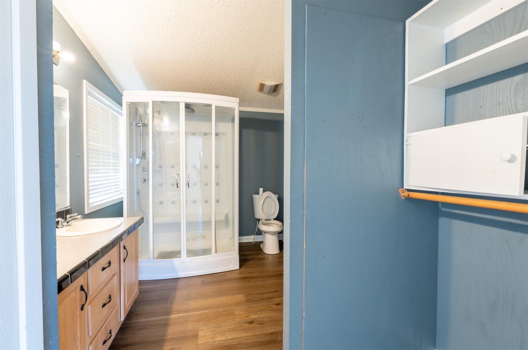 314 County Road 3577 Cleveland, TX 77327 - Photo 11 of 23 a bathroom with a double vanity sink and a mirror