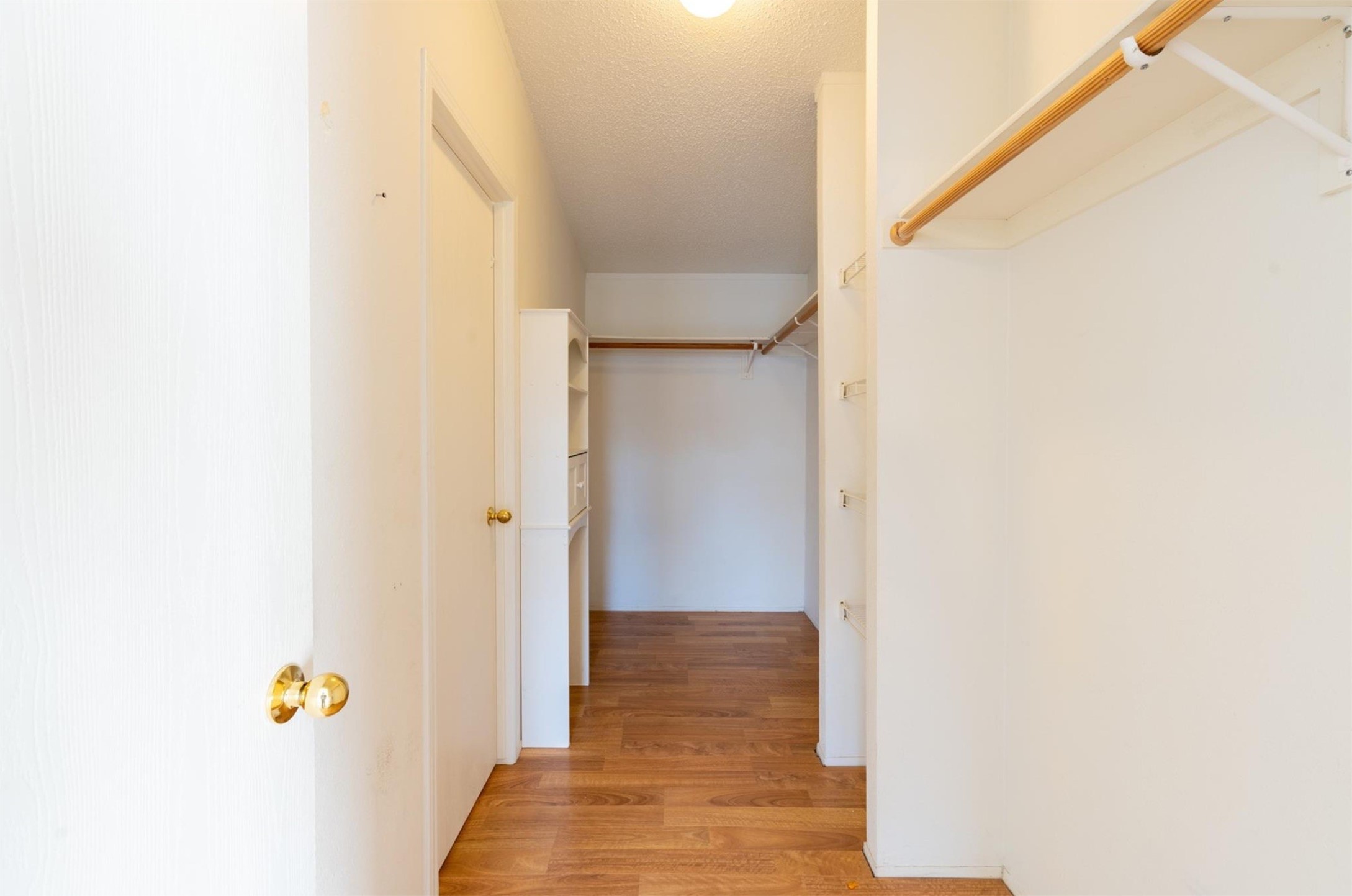 314 County Road 3577 Cleveland, TX 77327 - Photo 14 of 23 a view of a hallway with wooden floor and closet