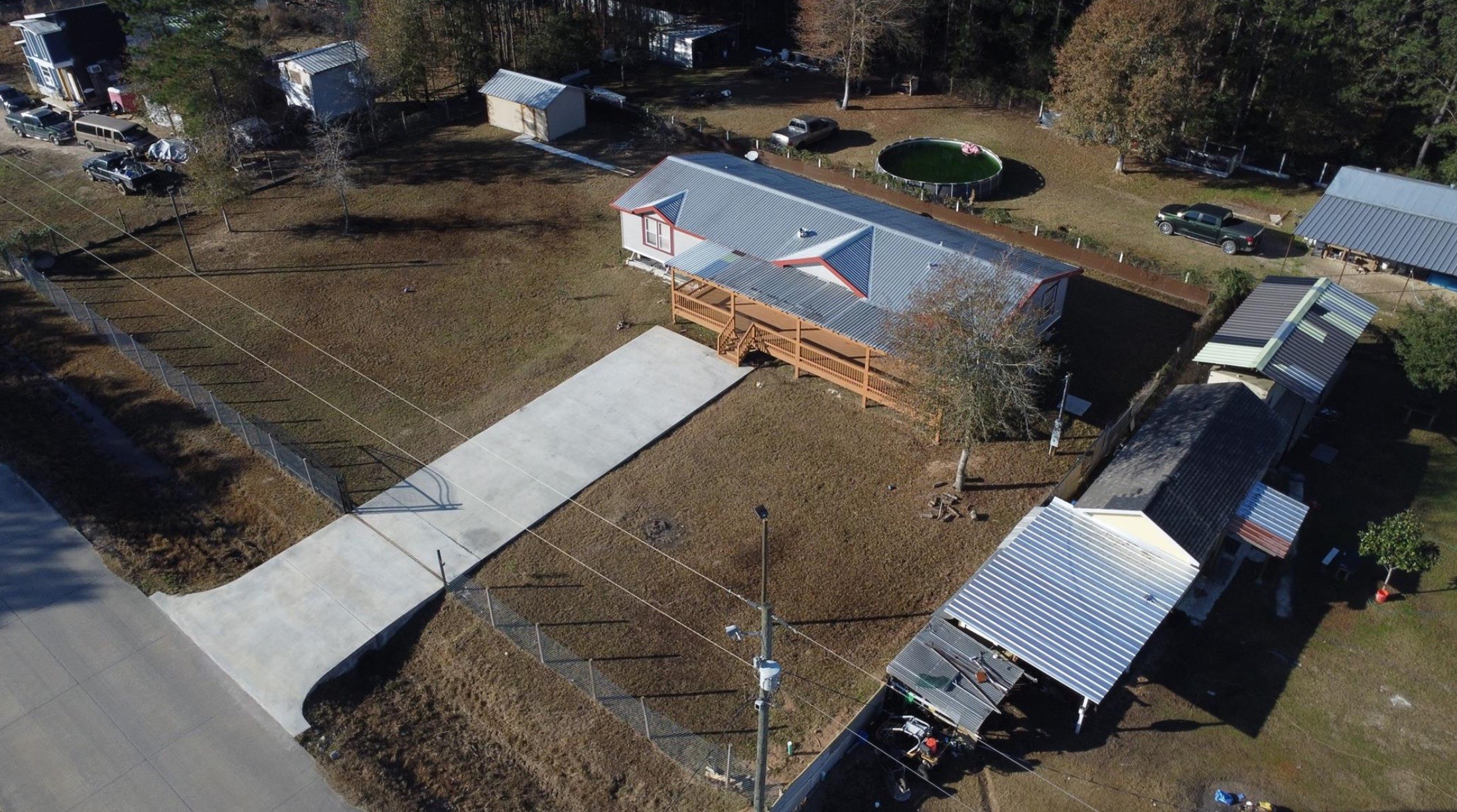 314 County Road 3577 Cleveland, TX 77327 - Photo 21 of 23 an aerial view of a house with a yard
