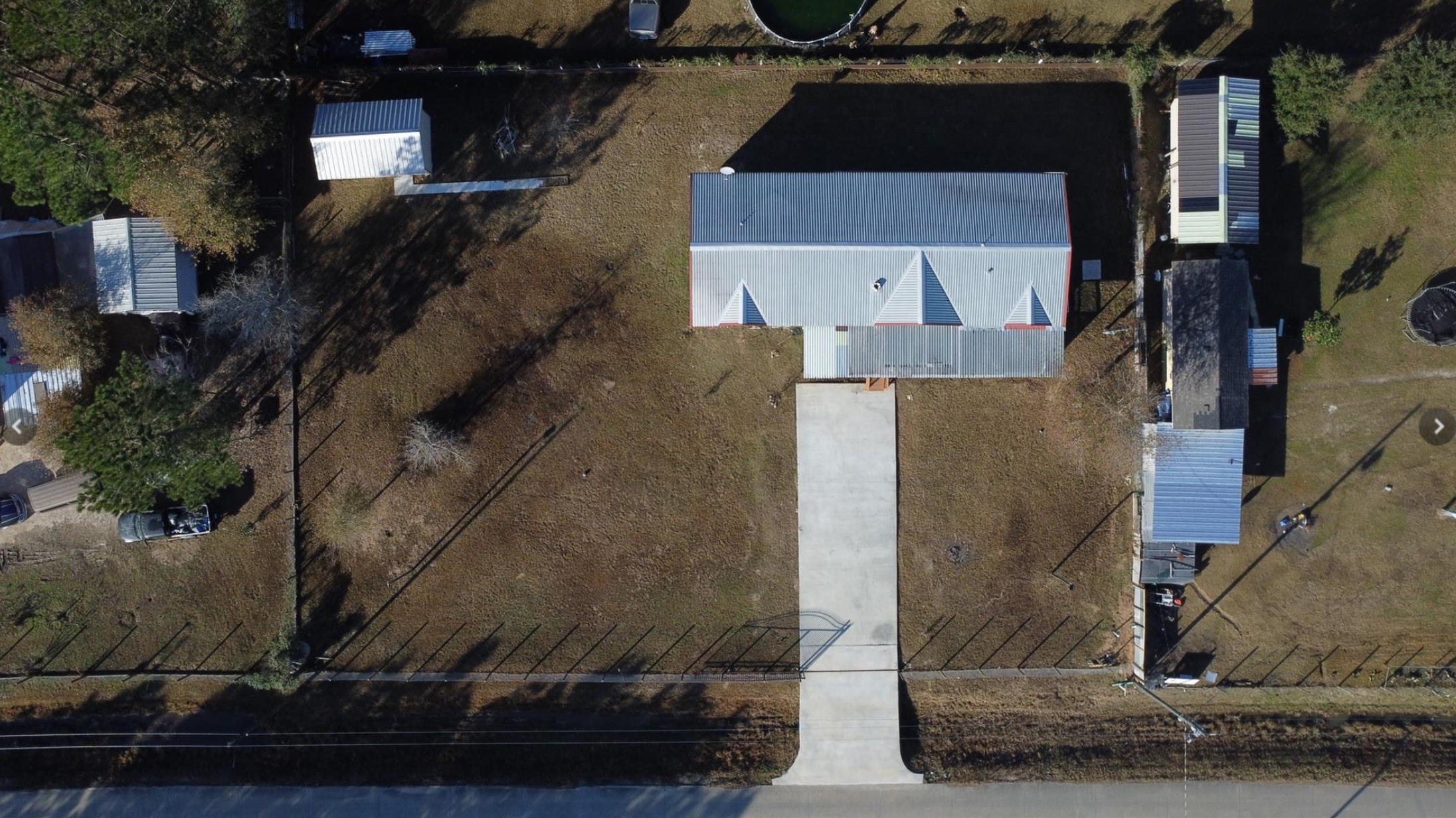 314 County Road 3577 Cleveland, TX 77327 - Photo 22 of 23 a aerial view of a house with a yard