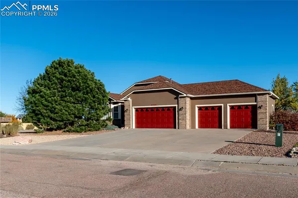 a front view of a house with a garage