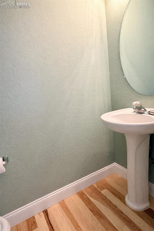 9385 Winged Foot Road Peyton, CO 80831 - Photo 14 of 50 a bathroom with a sink and a mirror
