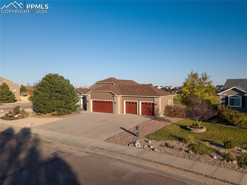 9385 Winged Foot Road Peyton, CO 80831 - Photo 2 of 50 a front view of a house with a yard