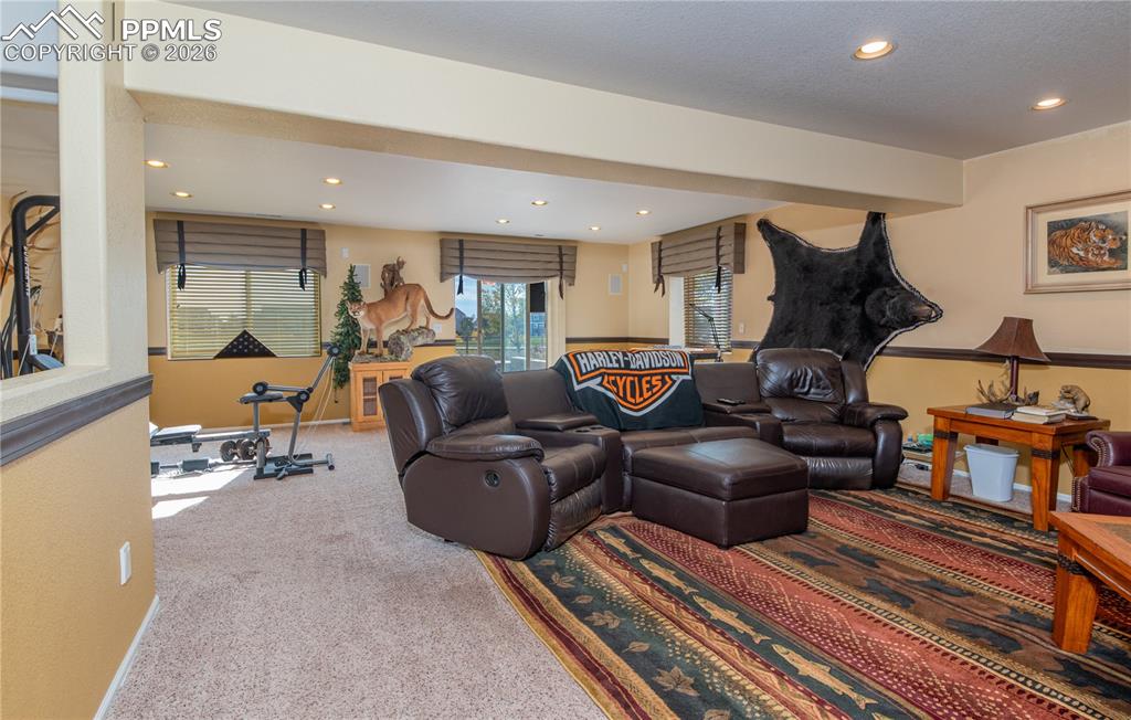 9385 Winged Foot Road Peyton, CO 80831 - Photo 28 of 50 a living room with furniture and wooden floor