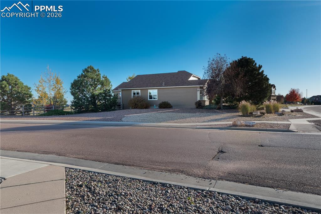 9385 Winged Foot Road Peyton, CO 80831 - Photo 44 of 50 a car parked on the side of the road