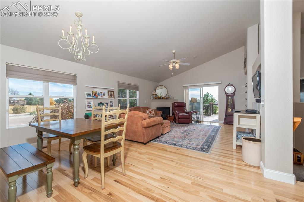 9385 Winged Foot Road Peyton, CO 80831 - Photo 7 of 50 a view of a dining room with furniture window and wooden floor