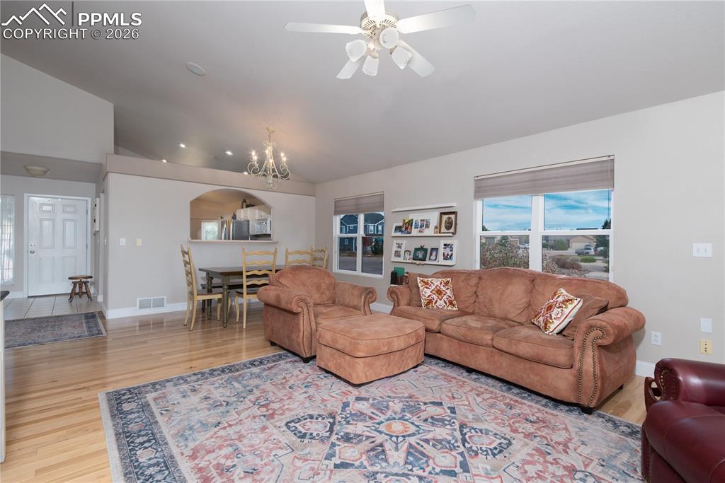 9385 Winged Foot Road Peyton, CO 80831 - Photo 8 of 50 a living room with furniture and a large window