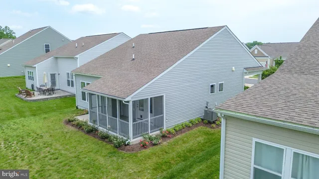 a aerial view of a house with a yard