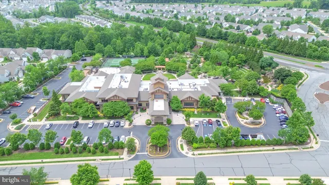 an aerial view of residential houses with outdoor space and street view