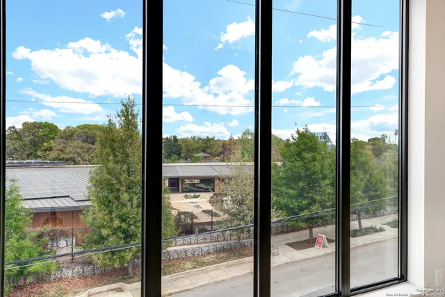 a view of a glass door and a floor to ceiling window