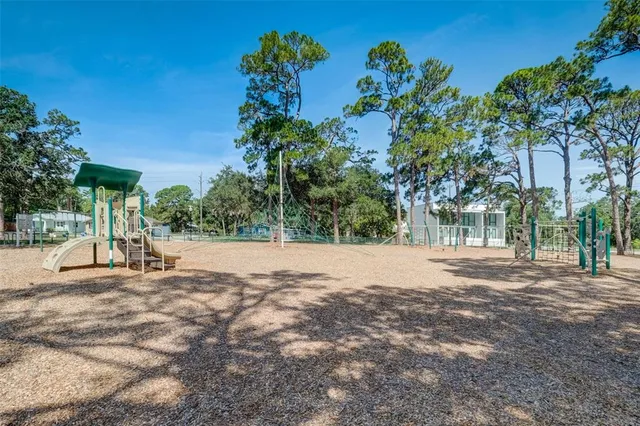 a view of road with a house in the background