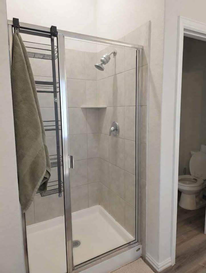 4105 Gildas Path Pflugerville, TX 78660 - Photo 9 of 15 A well-maintained bathroom with a spacious walk-in shower and modern fixtures.