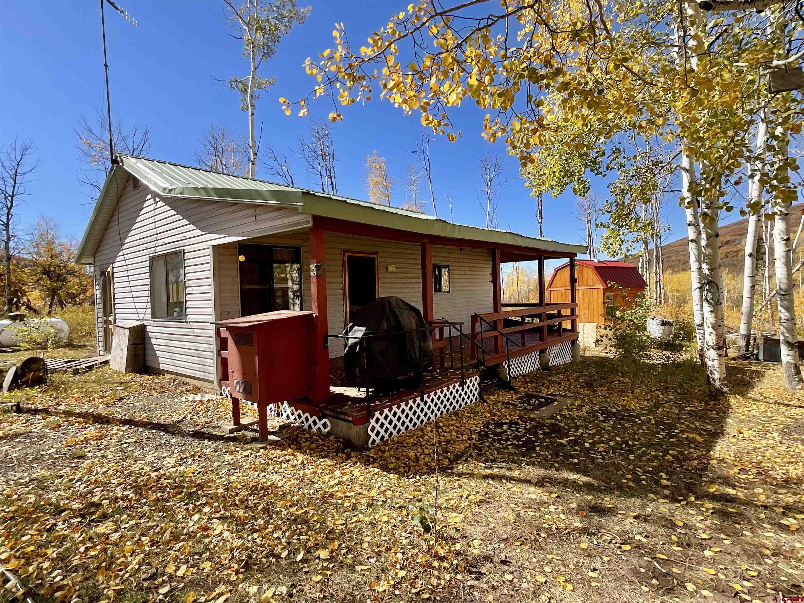 20261 3100th Road Hotchkiss, CO 81419 - Photo 2 of 41 a view of a house with a patio