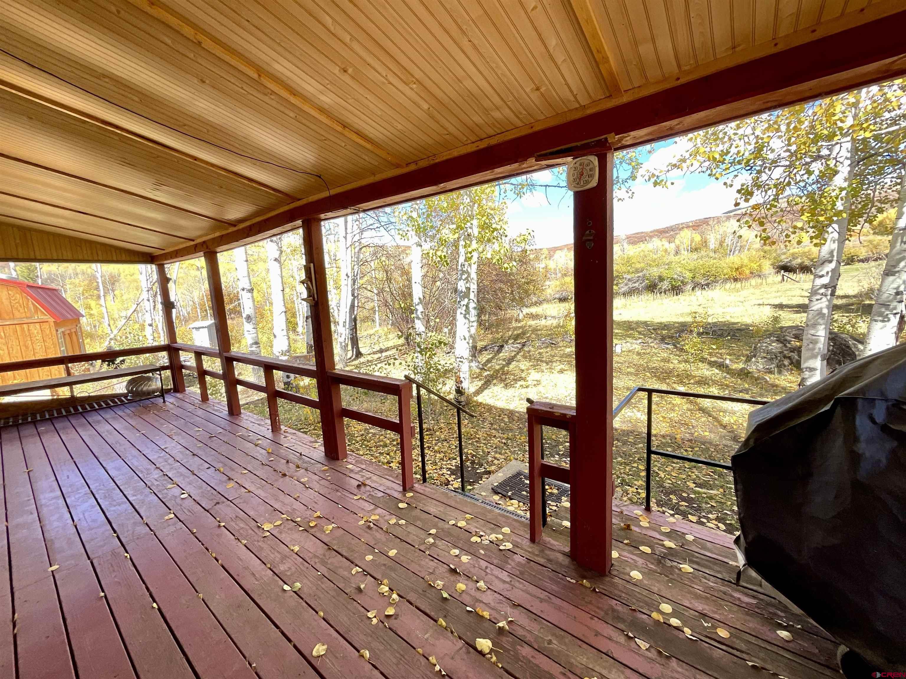 20261 3100th Road Hotchkiss, CO 81419 - Photo 3 of 41 a view of porch with wooden floor