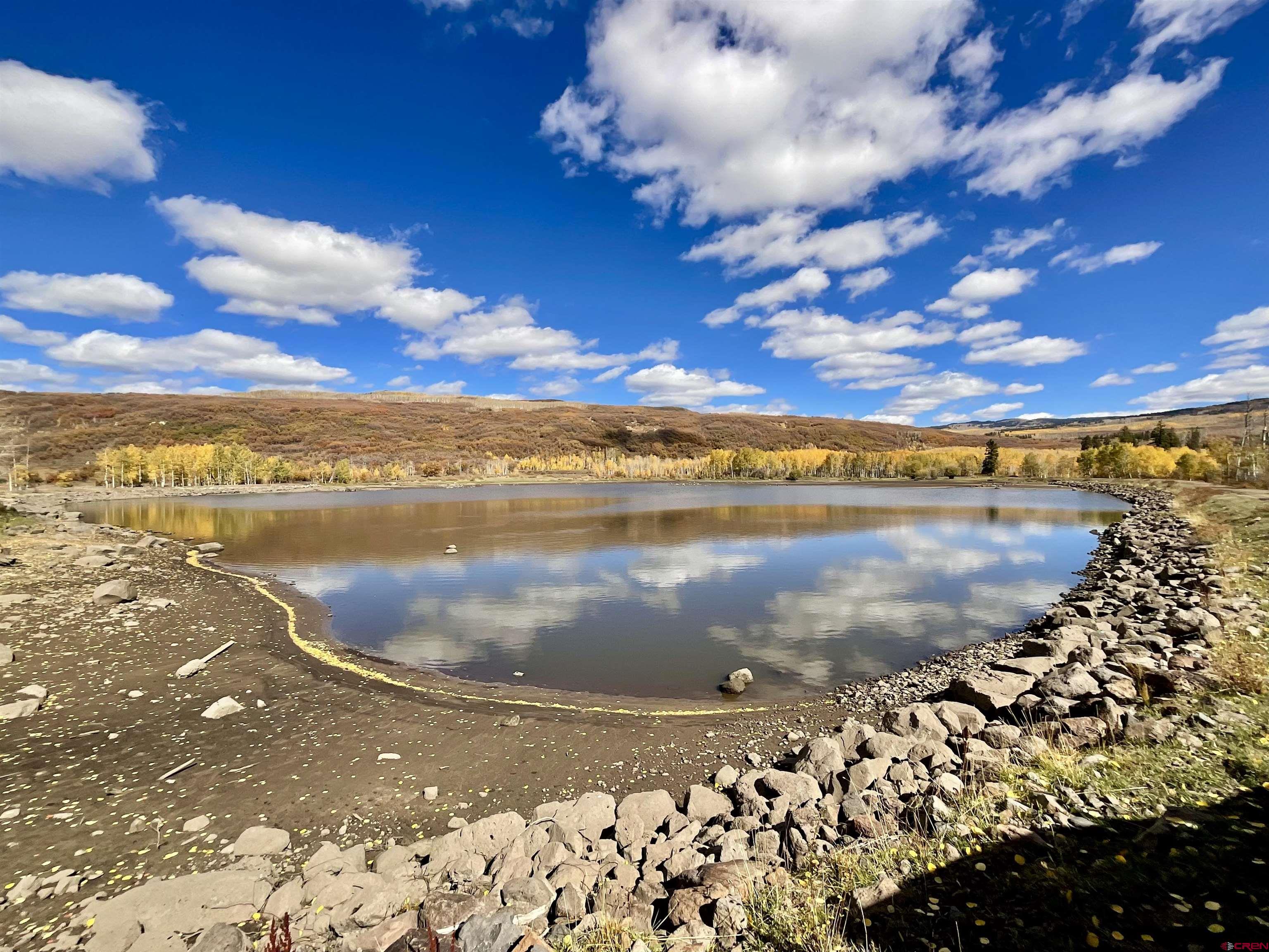 20261 3100th Road Hotchkiss, CO 81419 - Photo 34 of 41 a view of a lake from a yard