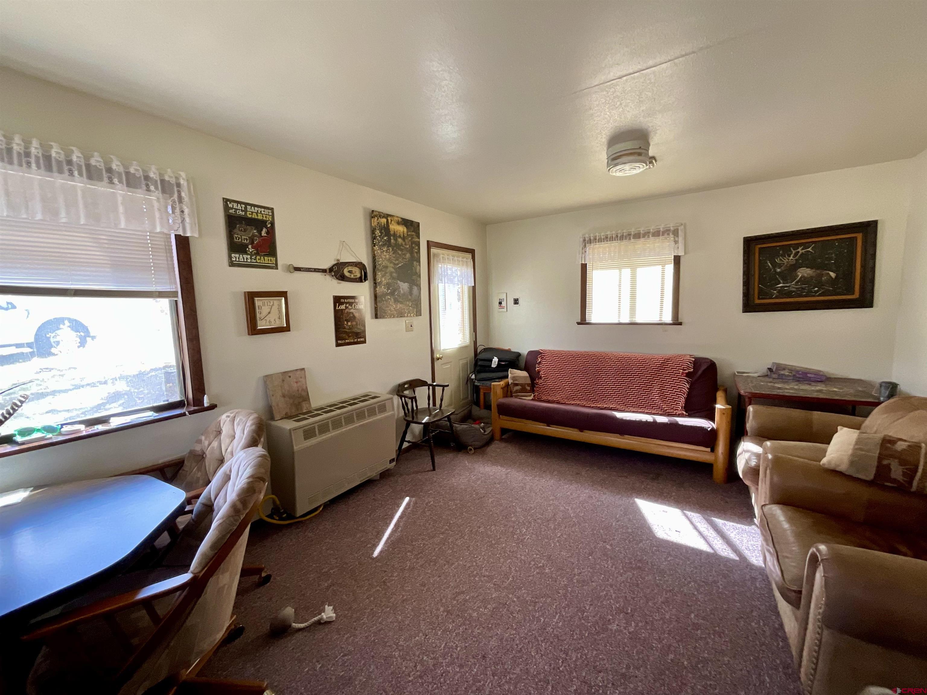 20261 3100th Road Hotchkiss, CO 81419 - Photo 4 of 41 a bedroom with furniture and a window