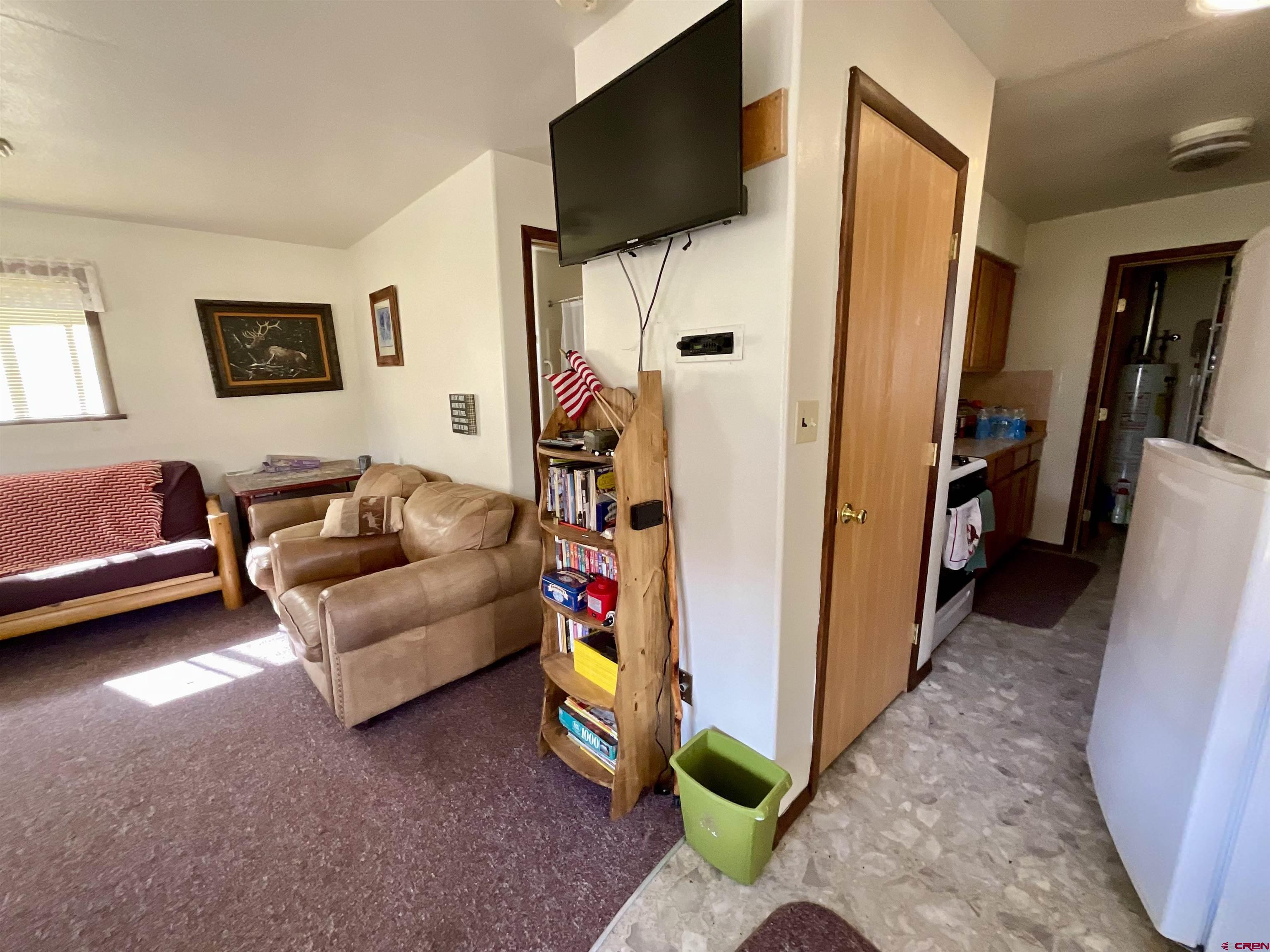 20261 3100th Road Hotchkiss, CO 81419 - Photo 6 of 41 a living room with furniture and a flat screen tv
