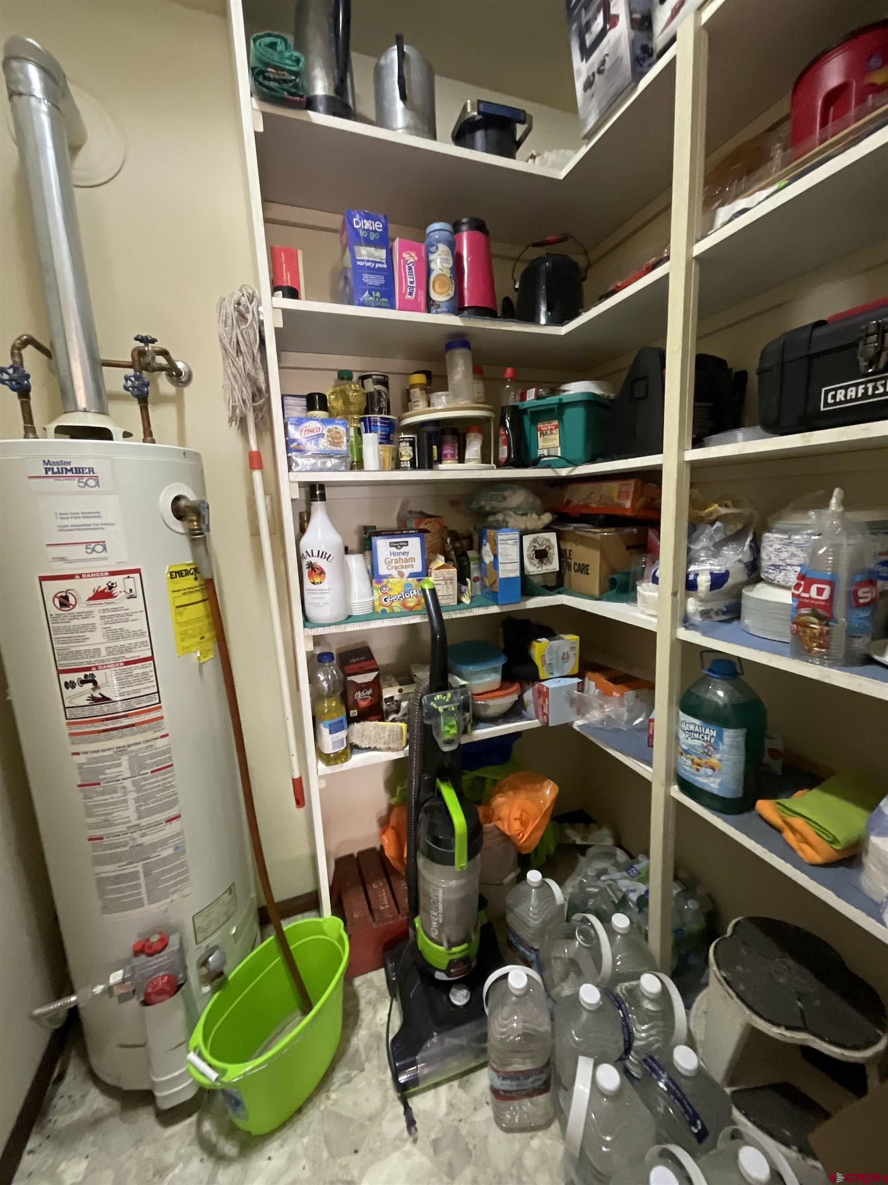 20261 3100th Road Hotchkiss, CO 81419 - Photo 8 of 41 a room with lots of different colored cloths