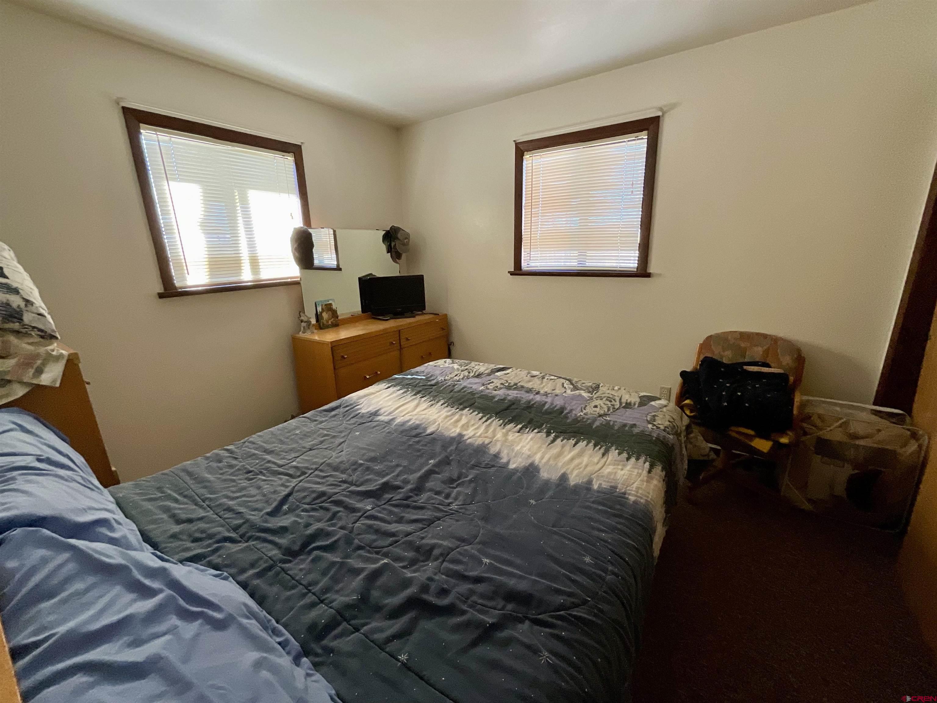 20261 3100th Road Hotchkiss, CO 81419 - Photo 10 of 41 a bedroom with a bed and a window