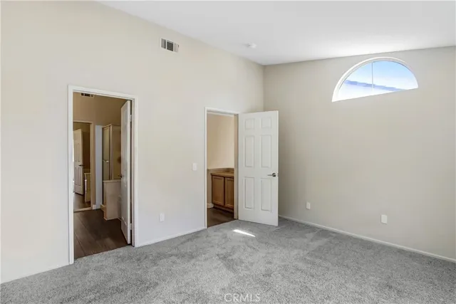 a bathroom with a double vanity sink mirror and toilet